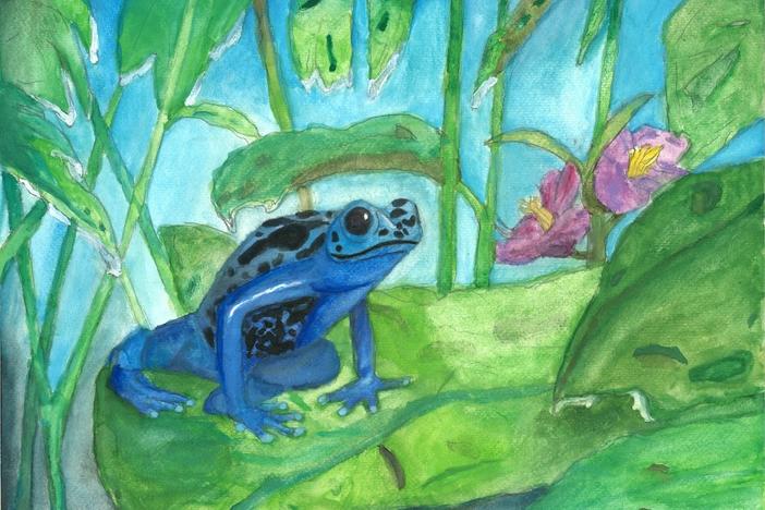 Blue frog sits on a green leaf with pink flowers and green foliage in the background.